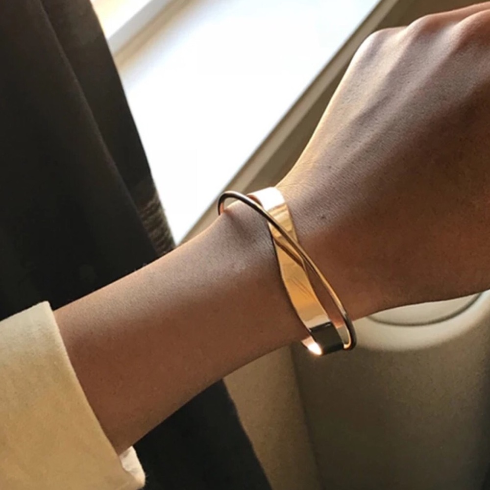 Golden cuff bracelet.